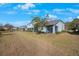 Spacious backyard with grassy area and view of community at 1608 Sunset Wind Loop, Oldsmar, FL 34677
