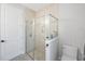 Clean bathroom featuring a walk-in shower and toilet at 1608 Sunset Wind Loop, Oldsmar, FL 34677
