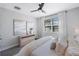 Bedroom with large bed, dresser, and calming wall art at 1608 Sunset Wind Loop, Oldsmar, FL 34677