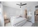 Spacious bedroom with ceiling fan and en-suite bathroom access at 1608 Sunset Wind Loop, Oldsmar, FL 34677