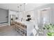 Modern kitchen with white cabinets, large island, and stainless steel appliances at 1608 Sunset Wind Loop, Oldsmar, FL 34677