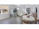 Spacious living room with large sectional sofa and round dining table at 1608 Sunset Wind Loop, Oldsmar, FL 34677
