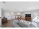 Bright loft with sectional sofa, hardwood floors, and a media cabinet at 1608 Sunset Wind Loop, Oldsmar, FL 34677