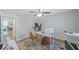 Home office with a desk, two chairs, and plenty of natural light at 1608 Sunset Wind Loop, Oldsmar, FL 34677