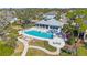 Community pool with cabana and ample lounge chairs at 1608 Sunset Wind Loop, Oldsmar, FL 34677