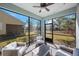 Enjoy the view from this screened porch with comfy seating at 1608 Sunset Wind Loop, Oldsmar, FL 34677