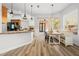 Kitchen dining area with built-in bench seating and farmhouse table at 16356 Marquis Rd, Brooksville, FL 34614