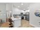 Modern kitchen with white cabinets, stainless steel appliances, and quartz countertops at 17514 Shadyside Cir, Lutz, FL 33549