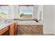 Bathroom with a large soaking tub and double sinks at 18119 Diamond Cove Ct, Tampa, FL 33647