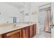 Bathroom with double vanity and separate tub and shower at 18119 Diamond Cove Ct, Tampa, FL 33647