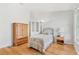 Small bedroom with wood floors and built-in shelving at 18119 Diamond Cove Ct, Tampa, FL 33647