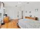 Bedroom with wood floors and a dresser at 18119 Diamond Cove Ct, Tampa, FL 33647