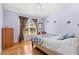 Spacious bedroom with wood floors and large window at 18119 Diamond Cove Ct, Tampa, FL 33647