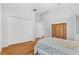 Bedroom with wood floors and double door closet at 18119 Diamond Cove Ct, Tampa, FL 33647