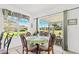 Bright breakfast nook with view of backyard and sliding glass doors at 18119 Diamond Cove Ct, Tampa, FL 33647