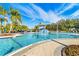 Large community pool with a waterslide and plenty of lounge chairs at 18119 Diamond Cove Ct, Tampa, FL 33647