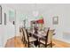 Spacious dining room with hardwood floors and large windows at 18119 Diamond Cove Ct, Tampa, FL 33647