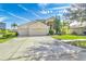 Two-story house with a three-car garage and spacious driveway at 18119 Diamond Cove Ct, Tampa, FL 33647