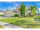 Two-story house with a three-car garage and manicured lawn at 18119 Diamond Cove Ct, Tampa, FL 33647