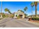 Community gated entrance with palm trees and landscaping at 18119 Diamond Cove Ct, Tampa, FL 33647