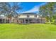 Two-story house with solar panels and a large screened patio at 18119 Diamond Cove Ct, Tampa, FL 33647