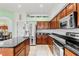 Spacious kitchen with granite countertops and stainless steel appliances at 18119 Diamond Cove Ct, Tampa, FL 33647