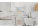 Bright laundry room with washer, dryer, and ample counter space at 18119 Diamond Cove Ct, Tampa, FL 33647