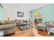 Comfortable living room with hardwood floors and neutral furniture at 18119 Diamond Cove Ct, Tampa, FL 33647