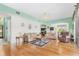 Bright and airy living room with hardwood floors and a view of the kitchen at 18119 Diamond Cove Ct, Tampa, FL 33647
