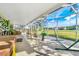 Spacious screened patio overlooking a lush green golf course at 18119 Diamond Cove Ct, Tampa, FL 33647