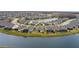 Bird's-eye view of lakefront community with numerous homes at 19771 Ship Wheel Way, Land O Lakes, FL 34638