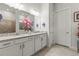 Double vanity bathroom with granite countertop and walk-in shower at 19771 Ship Wheel Way, Land O Lakes, FL 34638