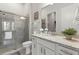 Bathroom with walk-in shower, granite countertop, and modern vanity at 19771 Ship Wheel Way, Land O Lakes, FL 34638