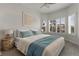 Spacious bedroom with large windows, neutral decor, and ample natural light at 19771 Ship Wheel Way, Land O Lakes, FL 34638