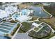 Aerial view of community amenities including pool, garden, and bocce at 19771 Ship Wheel Way, Land O Lakes, FL 34638