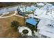 Relaxing fire pit and outdoor seating area with shade structure at 19771 Ship Wheel Way, Land O Lakes, FL 34638