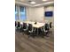 Modern conference room with large table and chairs at 19771 Ship Wheel Way, Land O Lakes, FL 34638