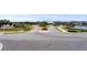 Community entrance with landscaping and a guard house at 19771 Ship Wheel Way, Land O Lakes, FL 34638