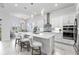 Modern kitchen with white cabinets and large island at 19771 Ship Wheel Way, Land O Lakes, FL 34638