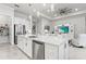 Modern kitchen with island, stainless steel appliances, and white cabinetry at 19771 Ship Wheel Way, Land O Lakes, FL 34638