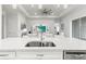 Kitchen island with double sink and white quartz countertop at 19771 Ship Wheel Way, Land O Lakes, FL 34638