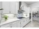 Kitchen with white cabinets, gas cooktop, and walk-in pantry at 19771 Ship Wheel Way, Land O Lakes, FL 34638