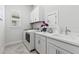 Laundry room with washer, dryer, and utility sink at 19771 Ship Wheel Way, Land O Lakes, FL 34638