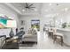 Open living room and kitchen with airy feel and island at 19771 Ship Wheel Way, Land O Lakes, FL 34638