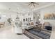 Open concept living room with seating area and kitchen view at 19771 Ship Wheel Way, Land O Lakes, FL 34638