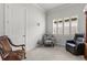 Bright office with two chairs and window with plantation shutters at 19771 Ship Wheel Way, Land O Lakes, FL 34638