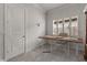 Bright home office with desk, chair, and window with plantation shutters at 19771 Ship Wheel Way, Land O Lakes, FL 34638