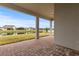 Covered patio overlooking a serene pond and landscape at 19771 Ship Wheel Way, Land O Lakes, FL 34638