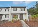 Two story house with gray door and white exterior at 2007 S Carolina Ave, Tampa, FL 33629