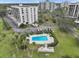 Aerial view showing condo, pool, and parking at 220 Belleview Blvd # 607, Belleair, FL 33756